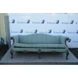 20th century mahogany framed sofa on carved cabriole legs with shaped back and arms,.