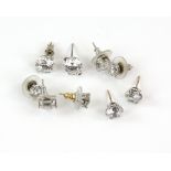 A group of stud earrings set with white synthetic stones, three mounted in 9 ct, one pair mounted in