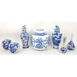Seven blue and white vases, including: two Chinese vases, each with a Kangxi four-character mark