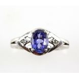 Tanzanite ring with small diamonds in the shoulders, marquise shaped setting, white gold, 9 ct