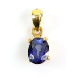 Oval cut sapphire pendant, four claw set, articulated bail, mount testing as 14 ct, 1.4 x 0.5cm.