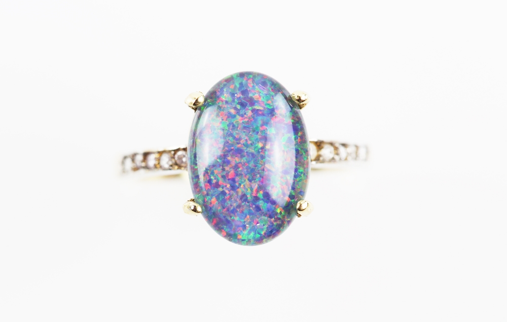 Black opal triplet ring, 14 x 9mm, diamond set shoulders, mounted in 18 ct gold, ring size P.