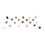 Twenty rings, mainly in silver, including lapis lazuli ring, size R, synthetic ruby ring, four