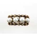Antique Italian pearl ring, set with four white pearls, each 4mm in diameter, bordered by cannetille