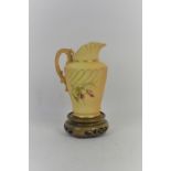 Royal Worcester spiral fluted jug, 1652, the C scroll and dolphin handle enriched with gilding. Puce