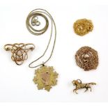 Group of jewellery, including gold medal, horse charm and two chains, all in 9 ct, with a silver