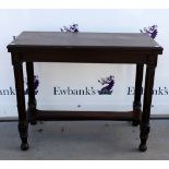 Early 20th century oak folding games table on fluted legs, swivel top with red leather surface