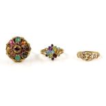 Three gem set rings, one multi gem ring, set with tigers eye, rubies, garnet, citrine and other