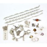 Group of mainly silver and white metal jewellery including a silver ingot, charm bracelet, citrine