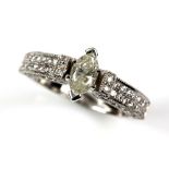 Contemporary diamond ring, centrally set with marquise cut diamond, diamond set shoulders, estimated