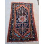 Two Persian style rugs, one with a blue ground, multiple borders, and another,.