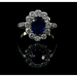 Sapphire and diamond cluster ring, oval cut sapphire, estimated weight 2.30 carats, set within a