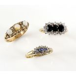 Three gem set rings, one set with sapphires and diamonds, another with sapphire and paste and a