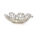 Ornate sterling silver dish by Bigelow, Kennard and Co set on four bun feet.