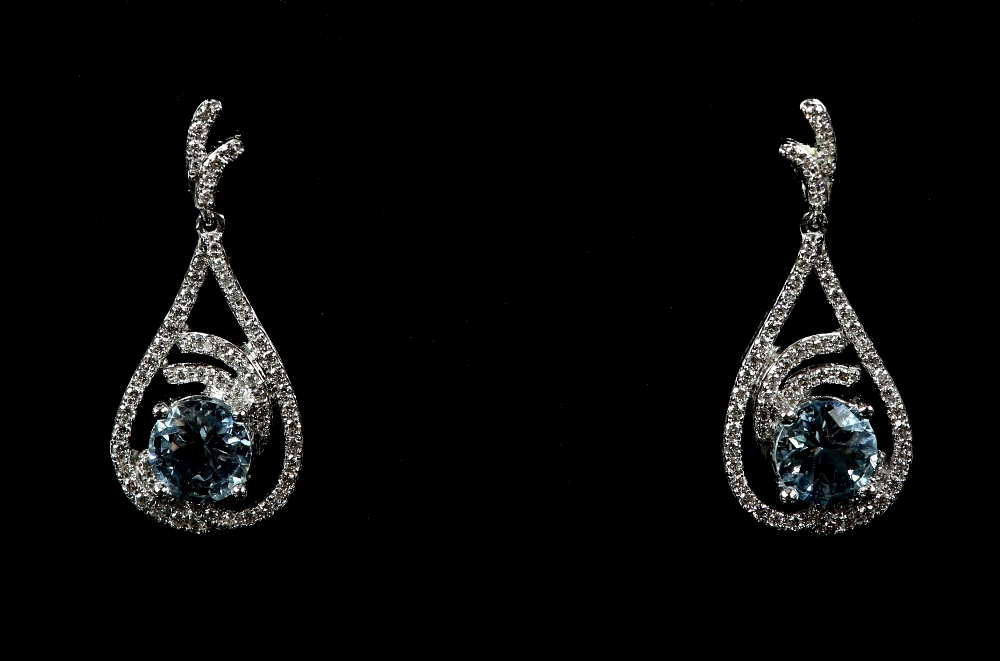 A pair of aquamarine and diamond drop earrings, mounted in 18 ct white gold, with post and butterfly