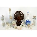 Collection of Lladro, Royal Copenhagen and other figures to include a Balinese carving.