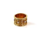 Gold Etruscan style ring set with diamonds and beaded decoration within a rope twist border,