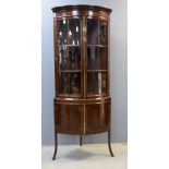 19th Century mahogany bow fronted display cabinet, the top with two glazed doors and the base with