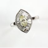 Marquise diamond cluster ring, central yellow marquise cut diamond, set in a frame of tapered