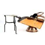 Copper coal scuttle and a brass and wrought iron trivet,.