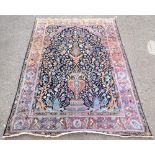 Antique Persian rug the central panel with a vase and birds amongst foliage, 208cm x 132cm..