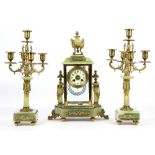 19th century onyx and gilt metal clock garniture, the white enamelled dial with Arabic numerals,