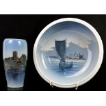 Royal Copenhagen dish decorated with a ship at sea, 25cm diameter, and a vase with a view of a