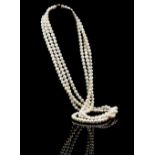 Opera length pearl three strand necklace, white pearls, 8mm in diameter, strung without knots,
