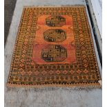 Persian style red ground rug with three medallions - 150 x 110 cm and another 140 x 96 cm .