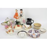 Staffordshire flatback figurine, porcelain floral encrusted basket, and other ceramics including