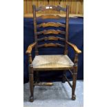 A set of six 19th century style ladder back dining chairs with rush seats, including one carver.