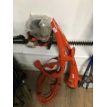 A HUSQVARNA PETROL HEDGE TRIMMER AND A FLYMO STRIMMER