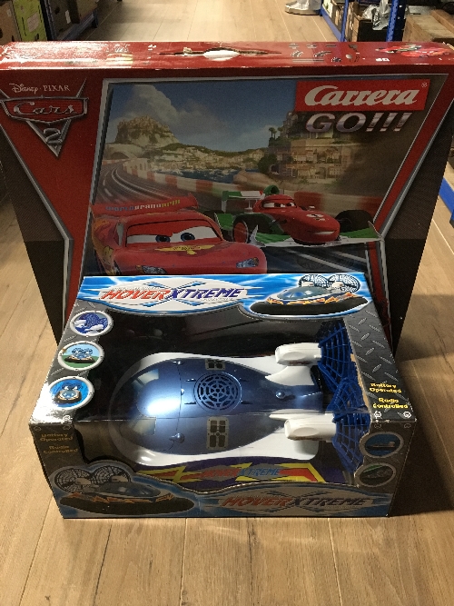 A HOVER XTREME HOVER CRAFT AND A LIGHTENING MCQUEEN SCALEXTRIC