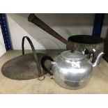 A SKILLET A TEA POT AND AN OLD IRON COOKING PAN