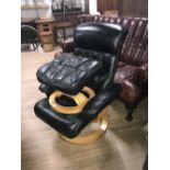 BLACK LEATHER ARMCHAIR AND FOOTSTOOL