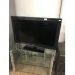 A 32" LG TV AND REMOTE