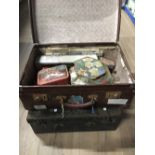 A VINTAGE SUITCASE AND CONTENTS AND METAL CASE