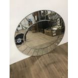 OVAL WALL MIRROR WITH OUTER SEGMENTED MIRROR FRAME