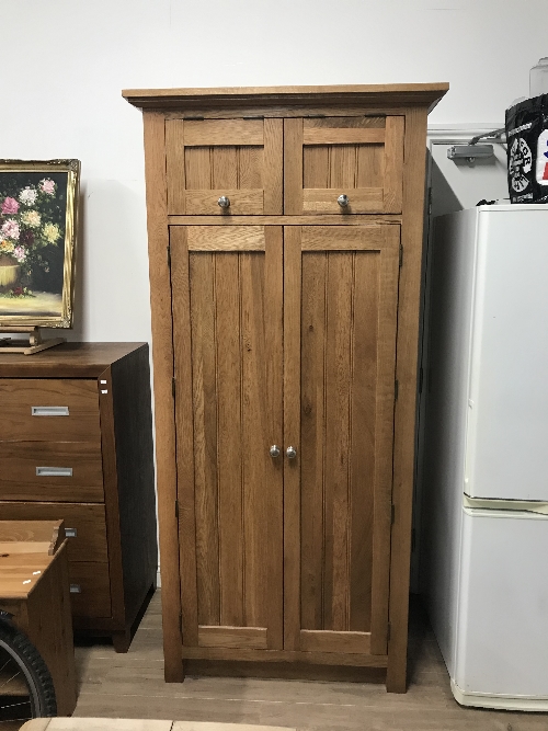 FROM THE SAME RANGE AS LOT 1 A SOLID OAK TALL KITCHEN FITTED CUPBOARD WITH PINE DRAWERS WINE RACK