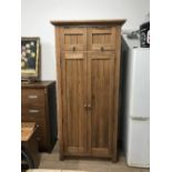 FROM THE SAME RANGE AS LOT 1 A SOLID OAK TALL KITCHEN FITTED CUPBOARD WITH PINE DRAWERS WINE RACK