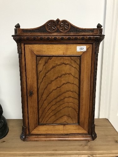 LATE 19THC CARVED OAK AND SATINWOOD SMOKERS CUPBOARD 38CM WIDE