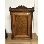 LATE 19THC CARVED OAK AND SATINWOOD SMOKERS CUPBOARD 38CM WIDE