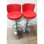 2 CHROME BASED RED FAUX LEATHER SEATED BREAKFAST STOOLS