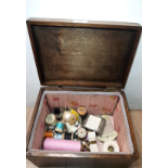 A SEWING BOX WITH CONTENTS