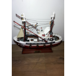 A PAINTED MODEL TRAWLER SHIP