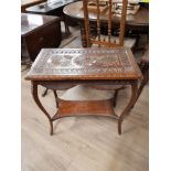 A CARVED TWO TIER TABLE WITH CABRIOLE LEGS