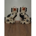 A TRUE PAIR OF ANTIQUE STAFFORDSHIRE HEARTH DOGS
