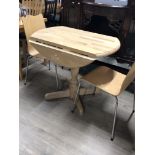 MODERN DROP LEAF PEDESTAL TABLE AND TWO IKEA CHAIRS
