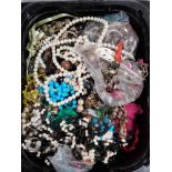 A CRATE OF COSTUME JEWELLERY INCLUDING NECKLACES AND EARRINGS ETC
