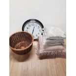 A MODERN WALL CLOCK AND WICKER BASKET TOGETHER WITH FOUR PAOLETTI CUSHIONS
